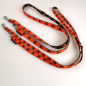 Preview: Leine 3fach verst. 1.6 - 2m, 15 + 20mm, Pfoten orange - schwarz Pfoten orange - schwarz